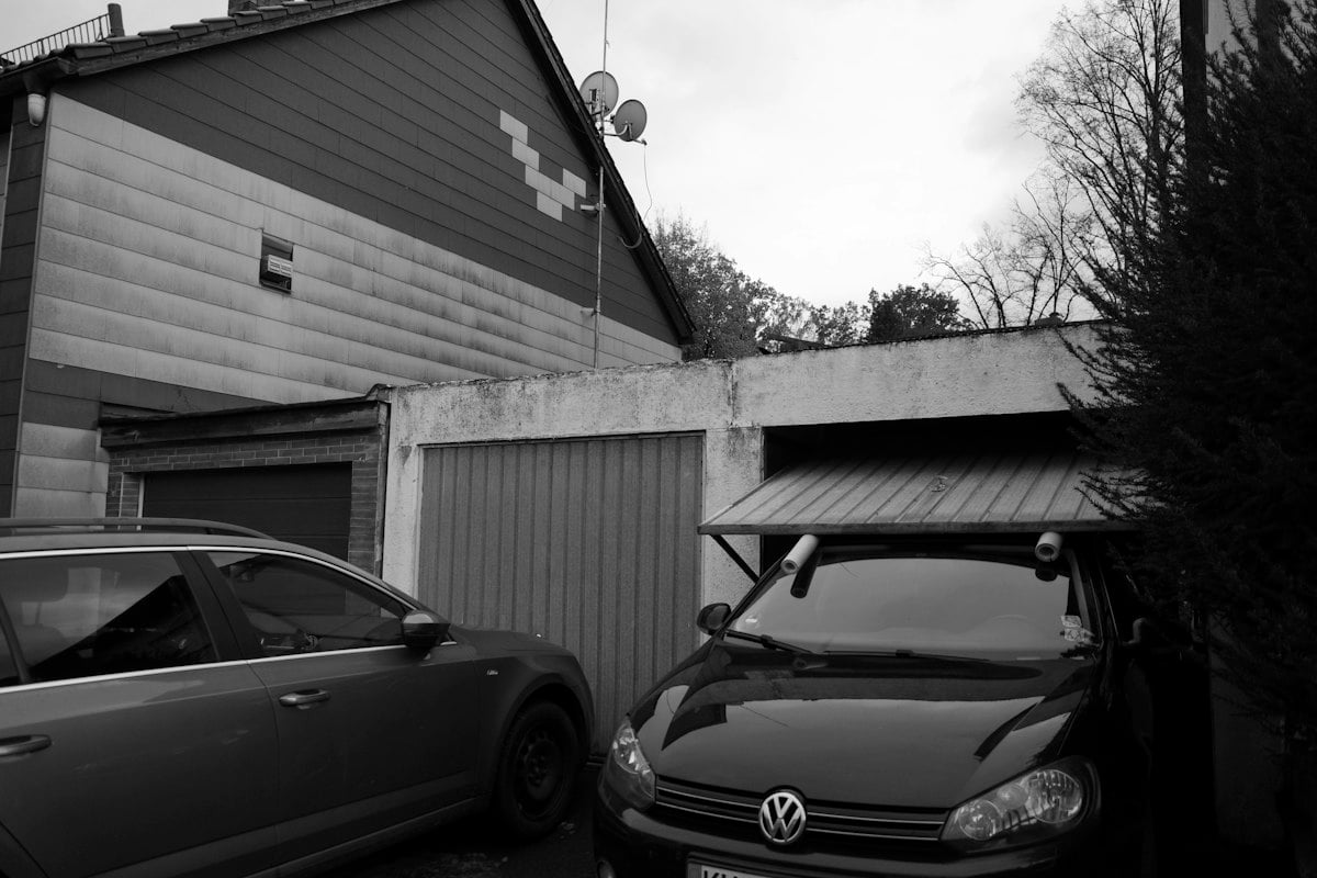Cars parked in front of closed garage doors
